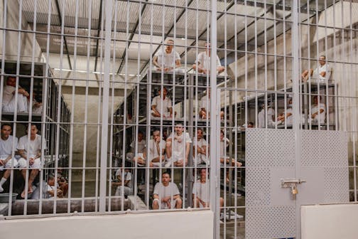 Inmates at the Terrorism Confinement Center, known as CECOT, in Tecoluca, El Salvador, in March. A former inmate released from CECOT in a prisoner swap described his experience to NPR in July as "hell on earth."