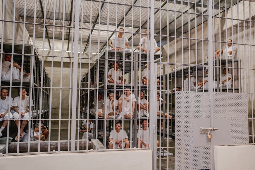 Inmates at the Terrorism Confinement Center, known as CECOT, in Tecoluca, El Salvador, in March. A former inmate released from CECOT in a prisoner swap described his experience to NPR in July as "hell on earth."