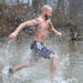 T. Grant Lewis of Winchester, Va., runs into the frigid water of the Shenandoah River in Bluemont, Va., Sunday, March 2, 2014, during the "Polar Plung