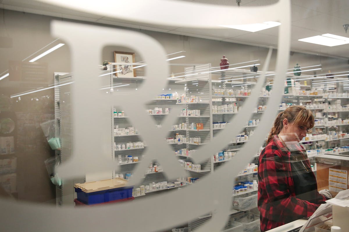 A pharmacy technician works at a pharmacy in Rohnert Park, Calif., Sept. 17, 2015.
