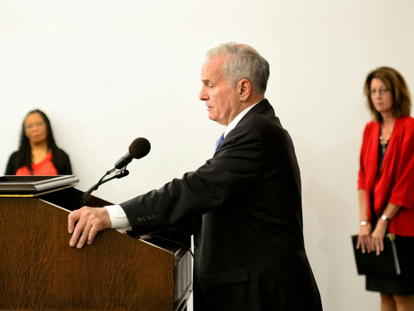 Governor Dayton with Ramsey County Commissioner Toni Carter and Commissioner Lucinda Jesson. Responding to the death of Eric Dean, Gov. Mark Dayton ordered two actions designed to step up the state's response to suspected child abuse. He ordered random state audits of counties' decisions on whether to accept or reject reports for investigation, and created a "rapid response" team of state child protection officials who will be available for consultation by counties. He also commissioned a task f