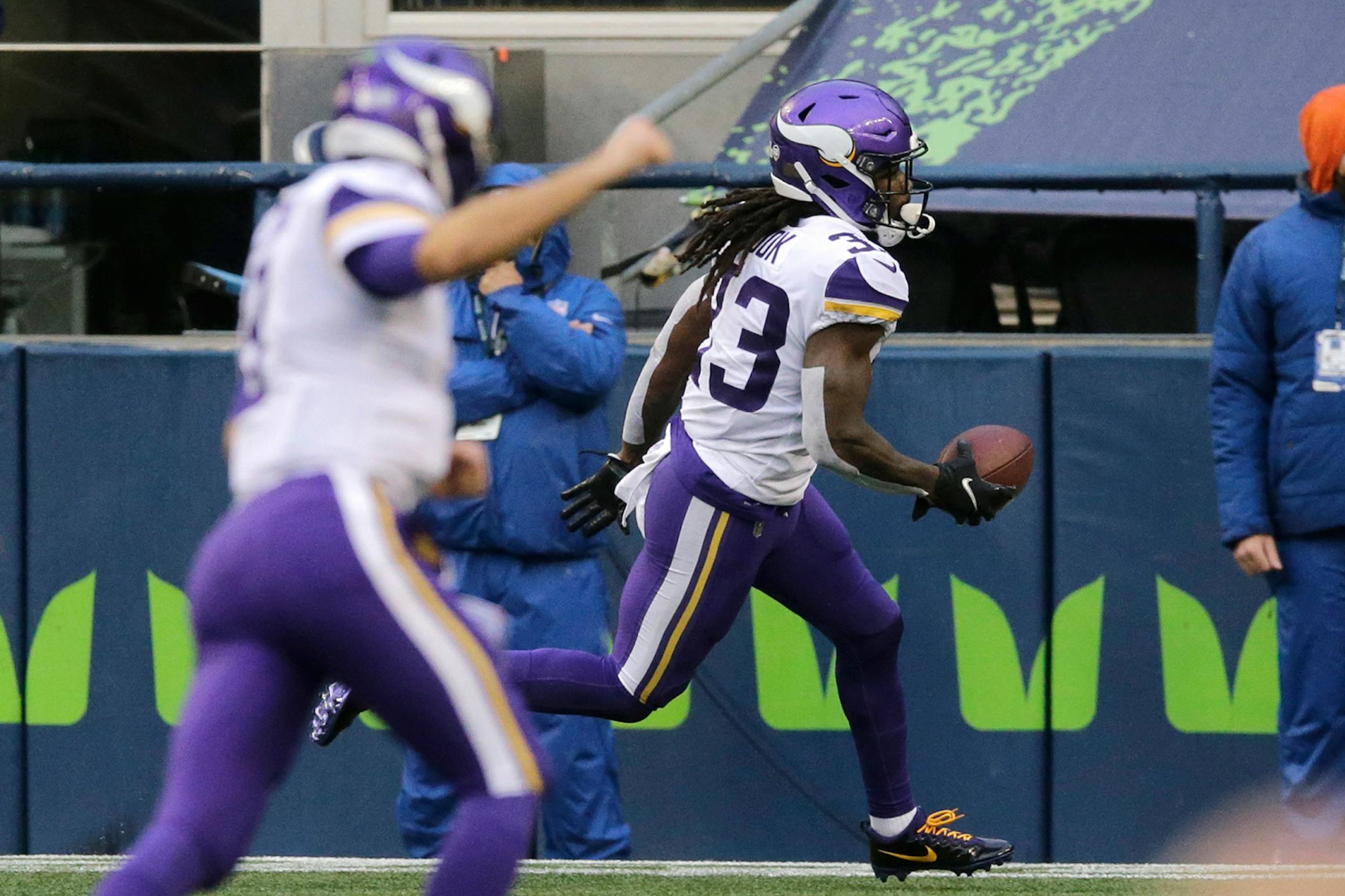 Minnesota Vikings' Dalvin Cook, right, scores a touchdown as quarterback Kirk Cousins follows during the first half of an NFL football game against the Seattle Seahawks, Sunday, Oct. 11, 2020, in Seattle. (AP Photo/John Froschauer)
