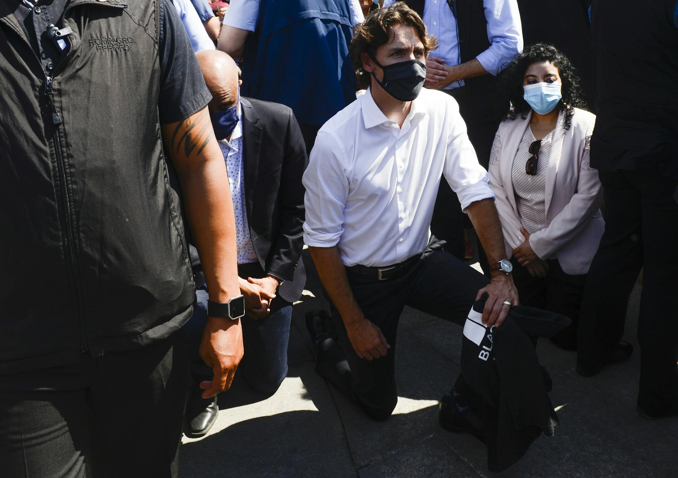 Prime Minister Justin Trudeau takes a knee as he takes part in an anti-racism protest on Parliament Hill during the COVID-19 pandemic in Ottawa, Friday, June 5, 2020. The death of George Floyd, a black man who died after he was restrained by Minneapolis police officers on May 25 has ignited protests in the U.S. and worldwide over racial injustice and police brutality. (Sean Kilpatrick/The Canadian Press via AP)
