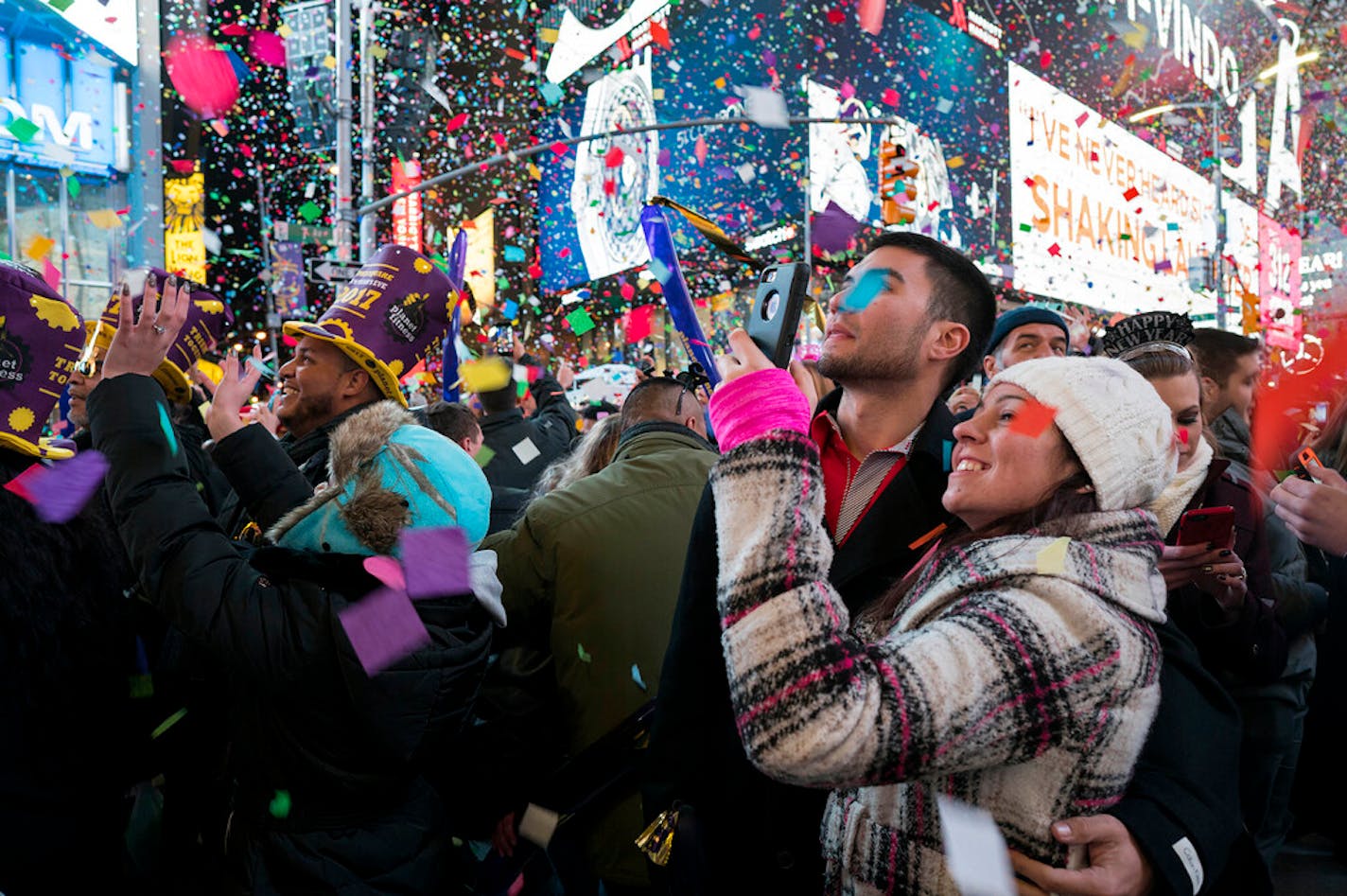 FILE — Confetti falls as people celebrate the new year in New York's Times Square, Jan. 1, 2017. Crowds will once again fill New York's Times Square this New Year's Eve, with proof of COVID-19 vaccination required for revelers who want to watch the ball drop in person, Mayor Bill de Blasio announced Tuesday, Nov. 16, 2021. (AP Photo/Craig Ruttle, File)