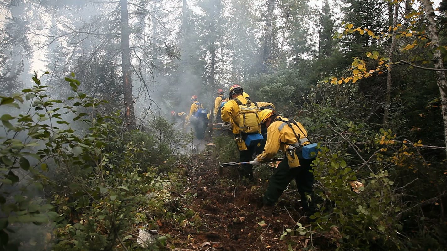 Danger of fire is currently high in the Boundary Waters and along the Canadian border. Here, fire crews fight a 2011 fire just south of the Boundary Waters. ORG XMIT: MIN2014122209303019