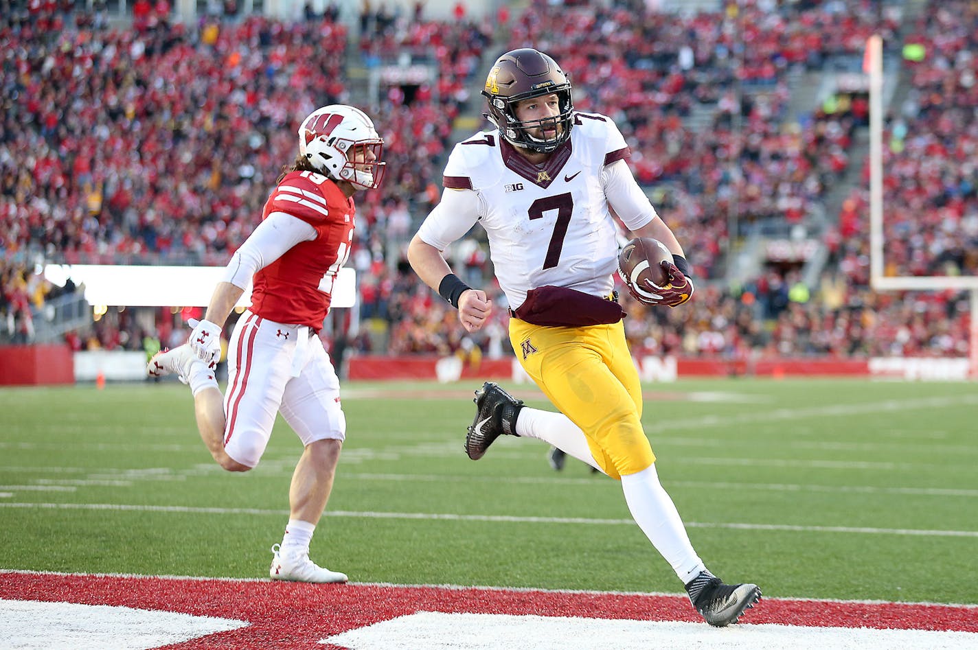 Wisconsin's Leo Musso couldn't catch Minnesota quarterback Mitch Leidner as he ran into the end zone for a touchdown in the second quarter