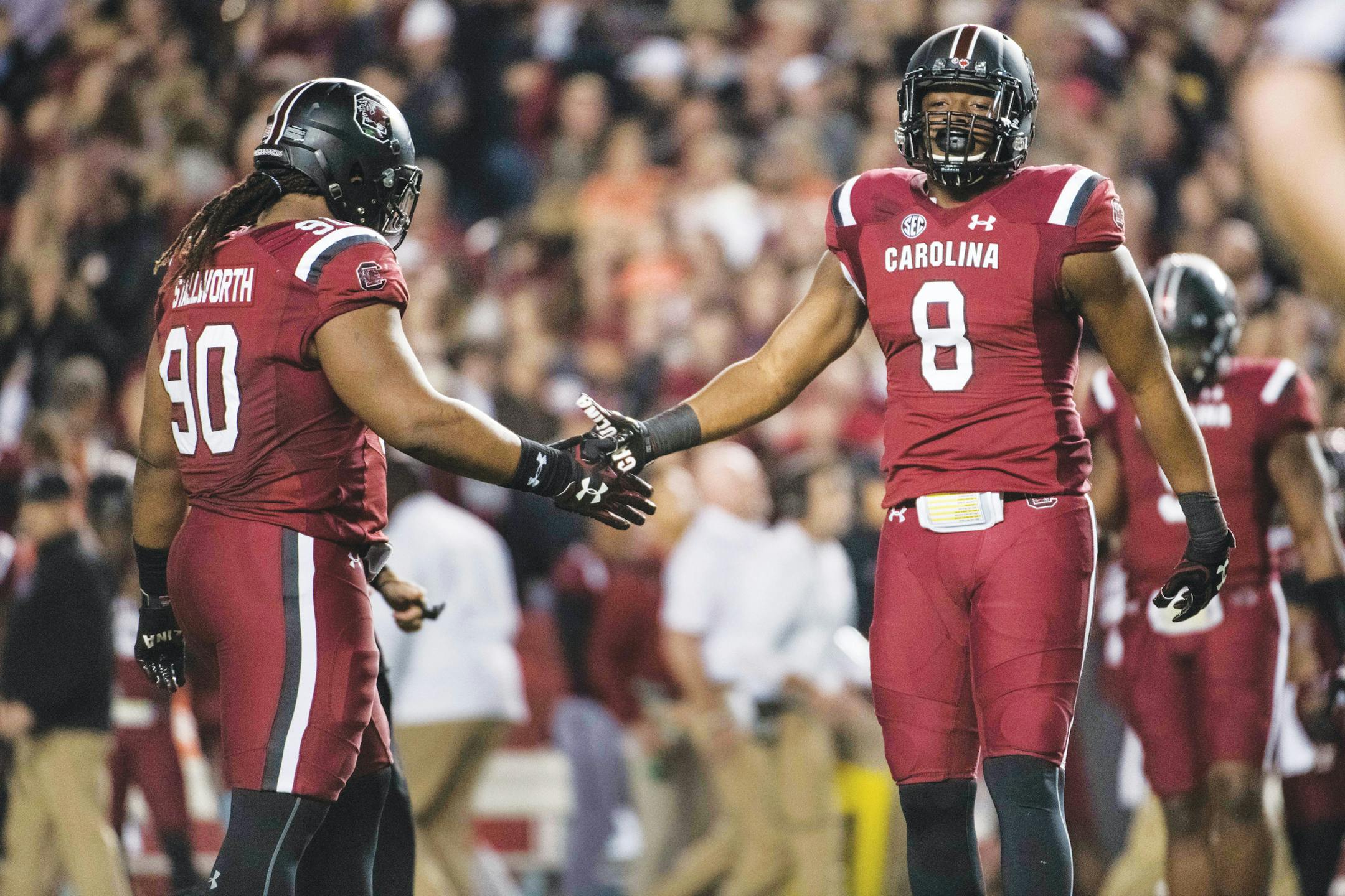 South Carolina defensive lineman D.J. Wonnum (8) and Taylor Stallworth (90) react after a play during the first half of an NCAA college football game against Clemson on Saturday, Nov. 25, 2017, in Columbia, S.C. Clemson defeated South Carolina 34-10. (AP Photo/Sean Rayford)