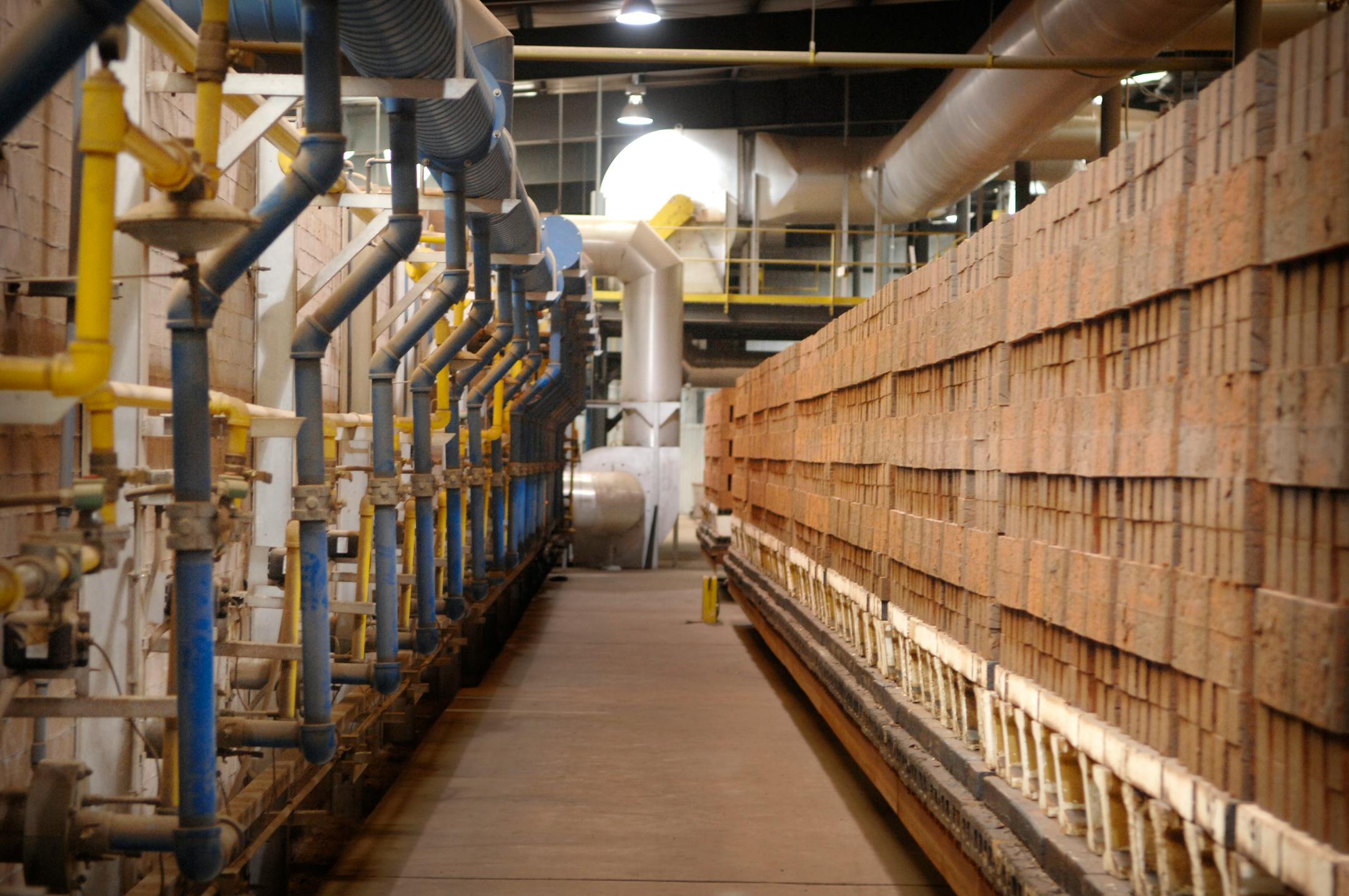 When the Ochs brick factory at Springfield, Minn., is in production, the natural-gas burners at left will heat bricks to over 2,000 degrees and the plant will support workers from half a dozen surrounding town in west-central Minnesota.