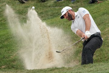Second round coverage of the 3M Open - Dustin Johnson hits his second chip shot out of the bunker just off the 9th green.