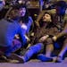 People are comforted after being struck by a vehicle on Red River Street in downtown Austin, Texas, during SXSW, March 12, 2014.