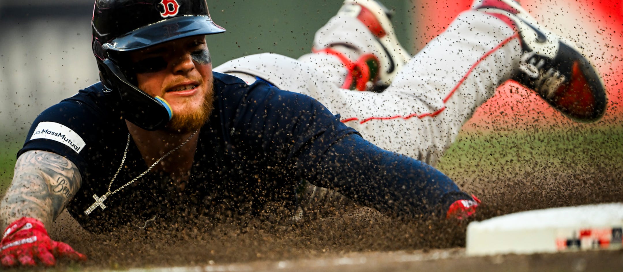 Boston Red Sox right fielder Alex Verdugo (99) slides safely into third after hitting a triple against the Minnesota Twins in the top of the fifth inning Wednesday, June 21, 2023, at Target Field in Minneapolis, Minn.