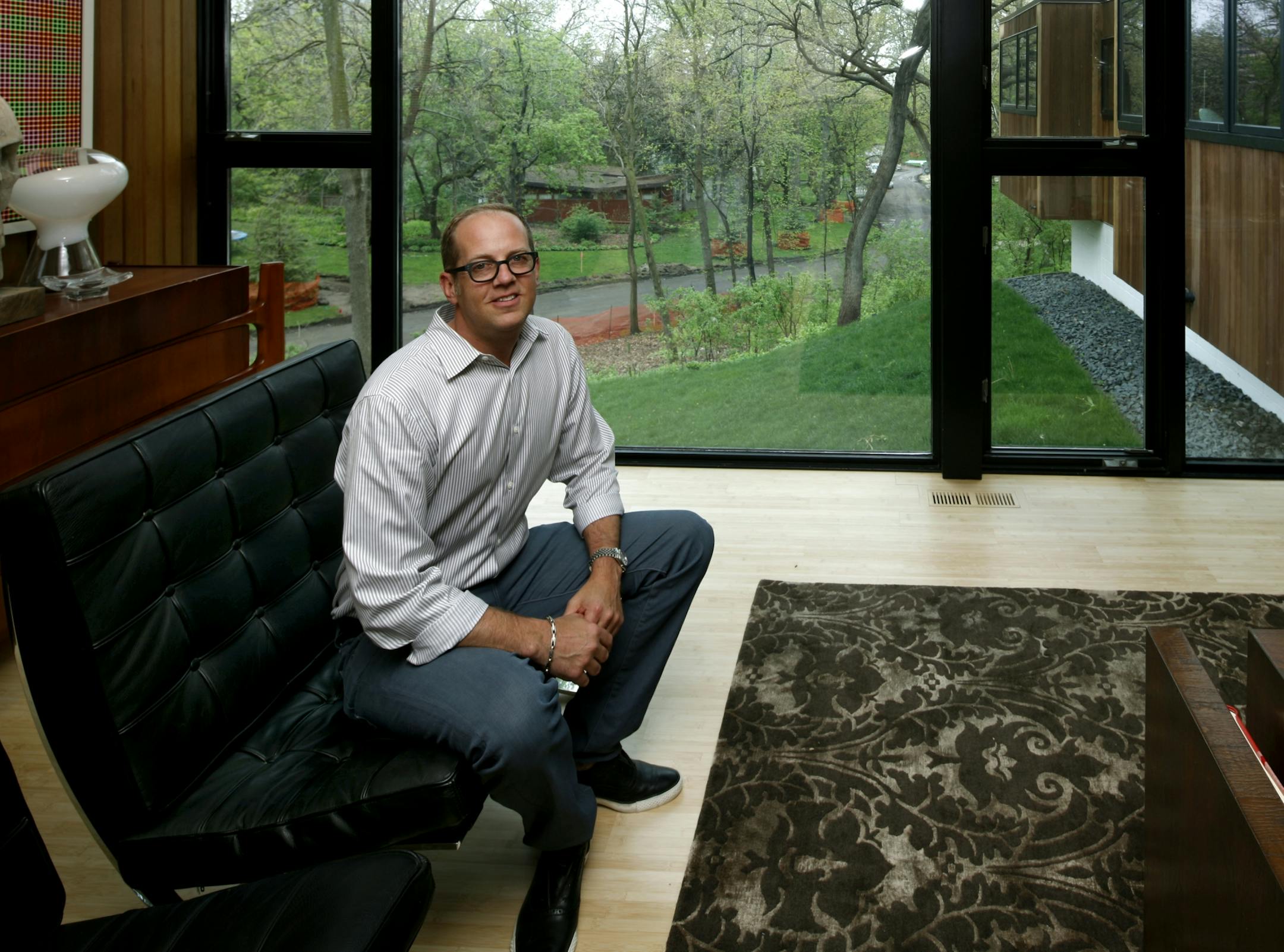 Interior designer Greg Walsh in his living room, has decked out his home in his signature thoroughkly modern style.