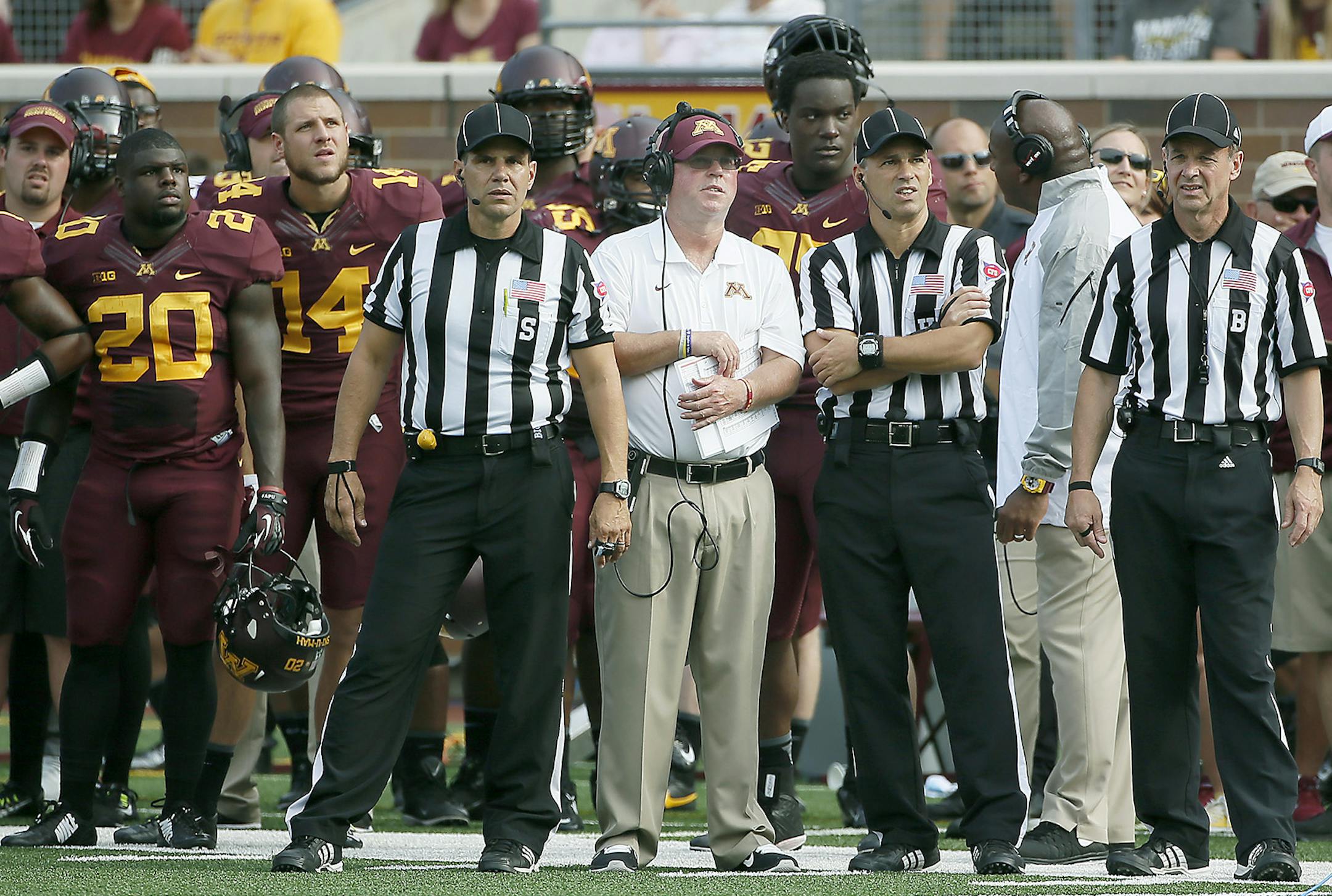 Minnesota Gopher head coach Jerry Kill, center, is surrounded by players and referees as they watched a replay in the third quarter as the Minnesota Gophers took on San Jose State at TCF Stadium, Saturday, September 20, 2014 in Minneapolis, MN. ] (ELIZABETH FLORES/STAR TRIBUNE) ELIZABETH FLORES • eflores@startribune.com