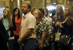 In this Sept. 19 file photo, Kira Steger's parents Jay Steger and Marcie Steger, center left and right, wait for an elevator before heading to the cou