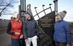 Holidaymakers Anna Dietrich, Pascale Reinhard and Jeanette Siehenthiler, from left, smile after playing a round of golf following the announcement tha