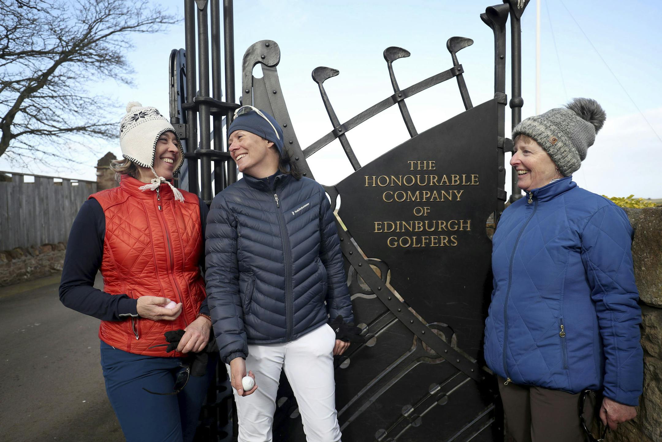 Holidaymakers Anna Dietrich, Pascale Reinhard and Jeanette Siehenthiler, from left, smile after playing a round of golf following the announcement that women will be admitted as members of Muirfield Golf Club after a membership ballot was held by The Honourable Company of Edinburgh Golfers, in Gullane, Scotland Tuesday, March 14, 2017. Muirfield Golf Club voted Tuesday to admit female members for the first time in its 273-year history, paving the way for the Scottish golf club to again host the