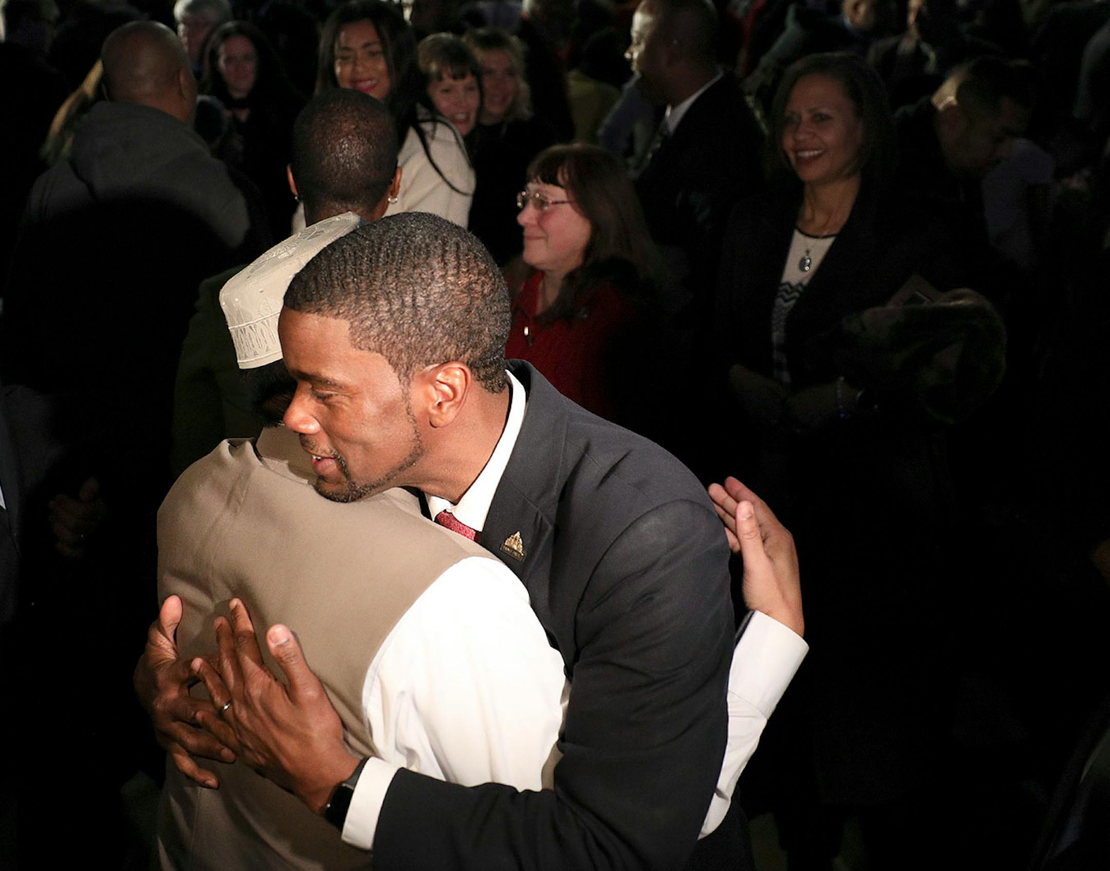 Melvin Carter got a hug after taking the oath of office during his swearing in ceremony as St. Paul mayor.