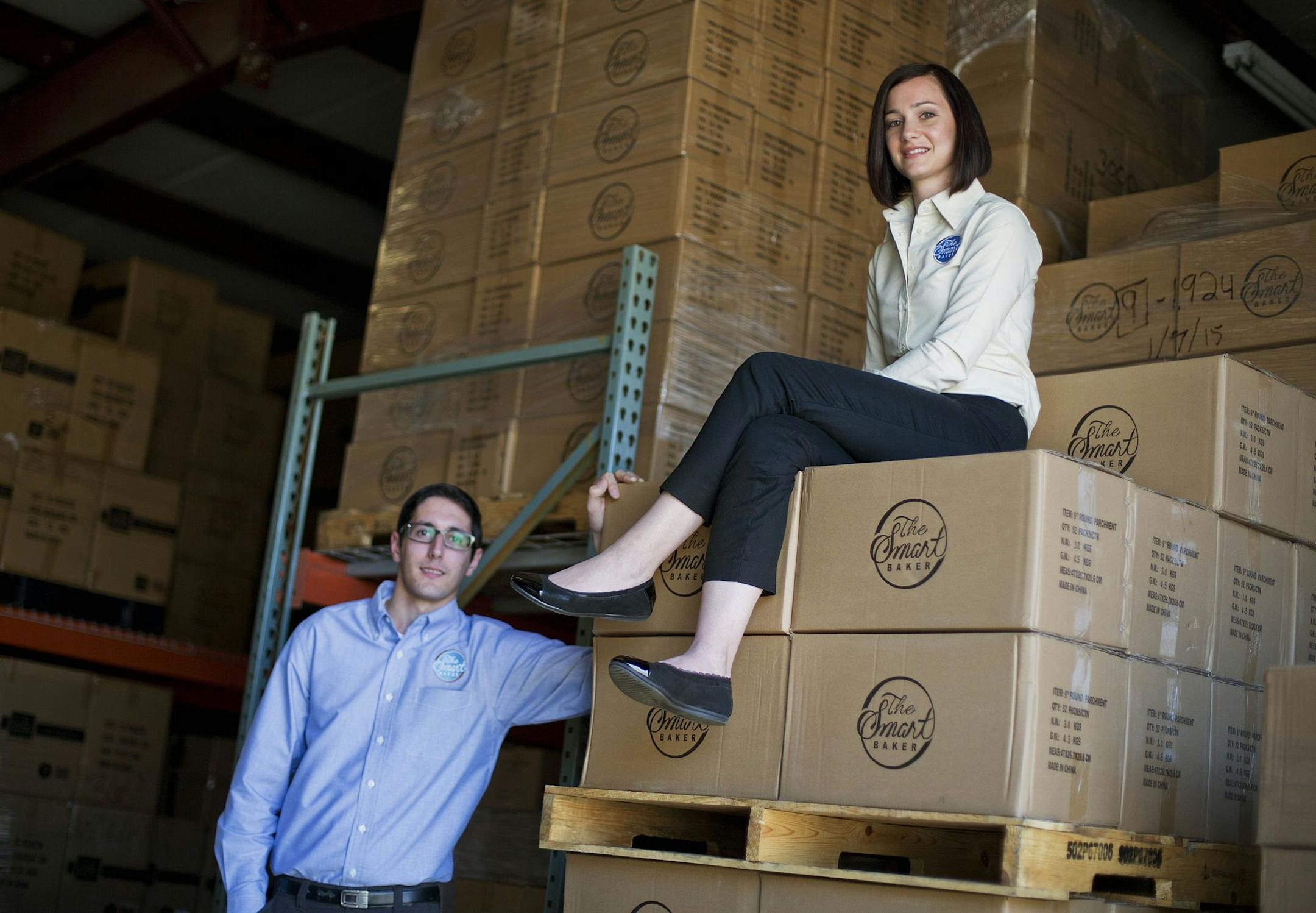 In this Sunday, Feb. 22, 2015 photo, Daniel Rensing, left and his wife Stephanie, owners of The Smart Baker, are photographed at their warehouse in Rockledge, Fla. Annual revenue for their company is close to $1 million, up from $130,000 before their March 2012 appearance on the reality TV show "Shark Tank". (AP Photo/David Goldman) ORG XMIT: NYBZ129