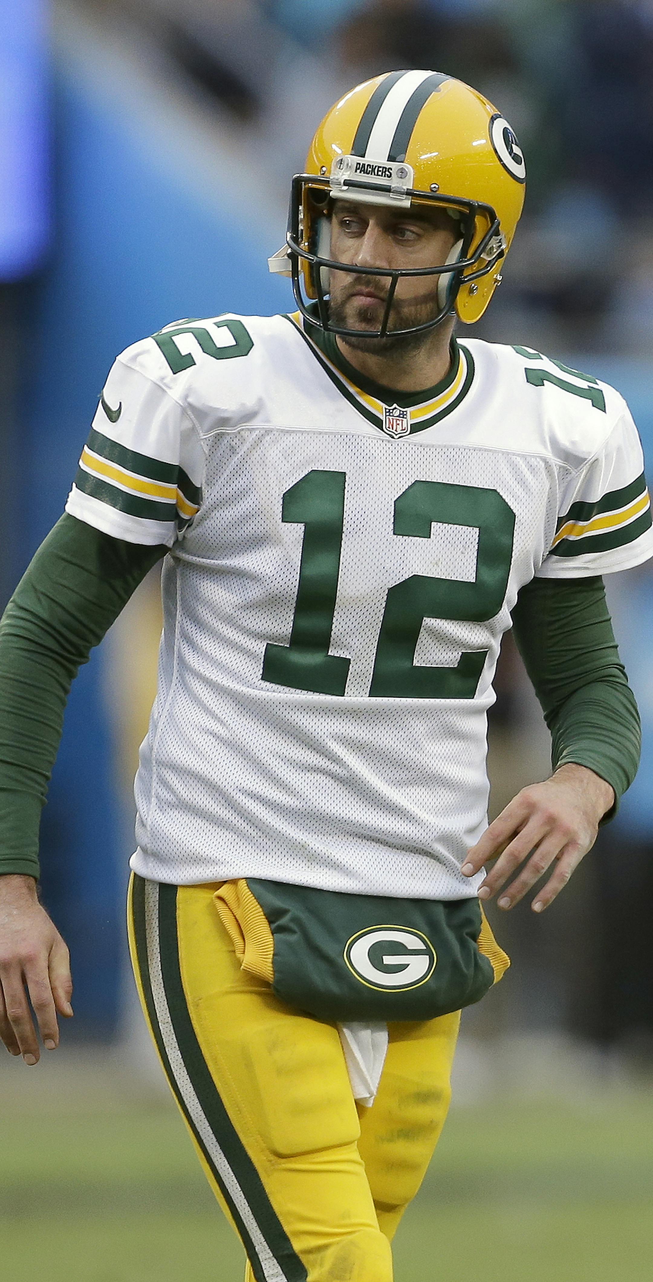 Green Bay Packers' Aaron Rodgers (12) walks alone against the Carolina Panthers during the second half of an NFL football game in Charlotte, N.C., Sunday, Nov. 8, 2015. The Panthers won 37-29. (AP Photo/Bob Leverone) ORG XMIT: MIN2015111621234979