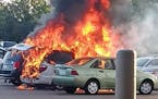 Two vans parked side by side outside a Walmart in Fridley caught fire Tuesday morning, and two young sisters alone in one of the vehicles were burned,