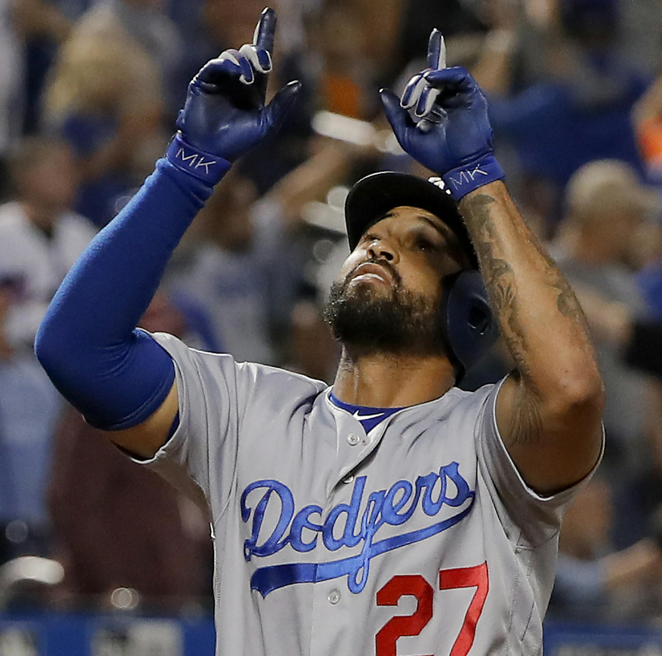 Los Angeles Dodgers' Matt Kemp (27) reacts as he crosses the plate after hitting a grand slam against the New York Mets during the eighth inning of a baseball game, Saturday, June 23, 2018, in New York. (AP Photo/Julie Jacobson)