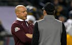 Gophers coach P.J. Fleck, left, talked to West Virginia coach Neal Brown on Tuesday before the Guaranteed Rate Bowl in Phoenix.