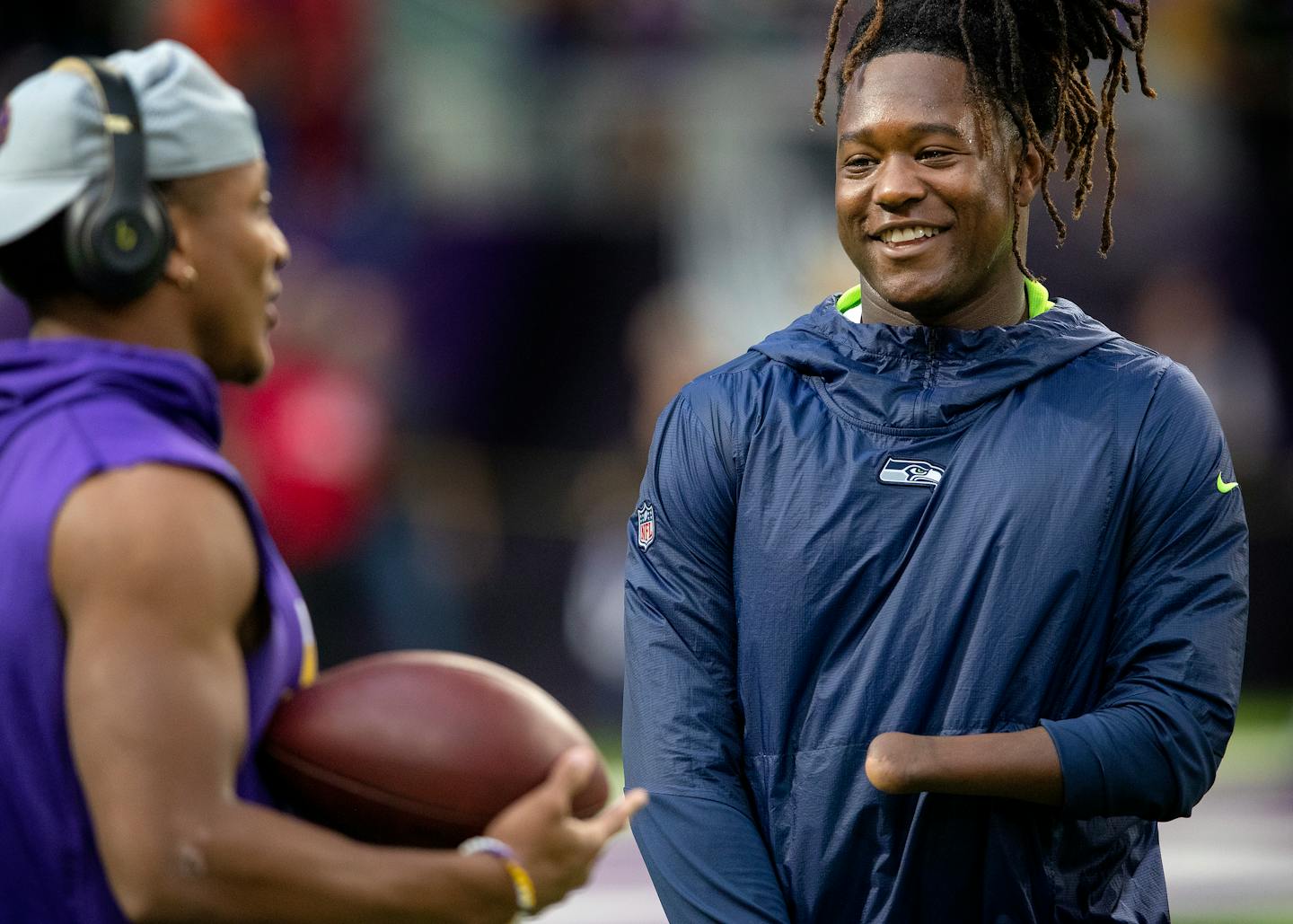 Vikings rookie Mike Hughes, left, spoke to the Seahawks' Shaquem Griffin before a preseason game on Friday