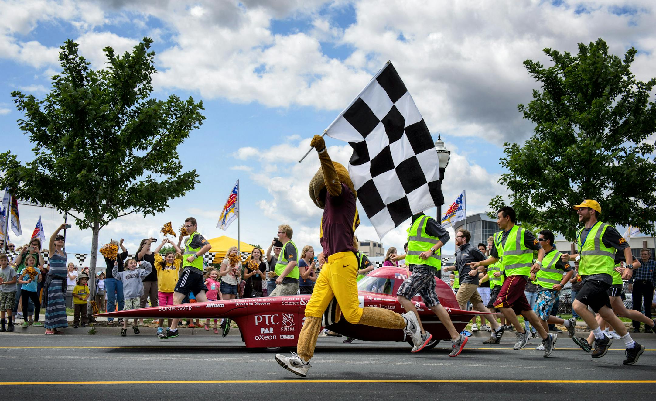 Goldy Gopher and the entire solar car crew escorted the University of Minnesota car. The American Solar Challenge, a solar car race, ended near TCF Stadium.