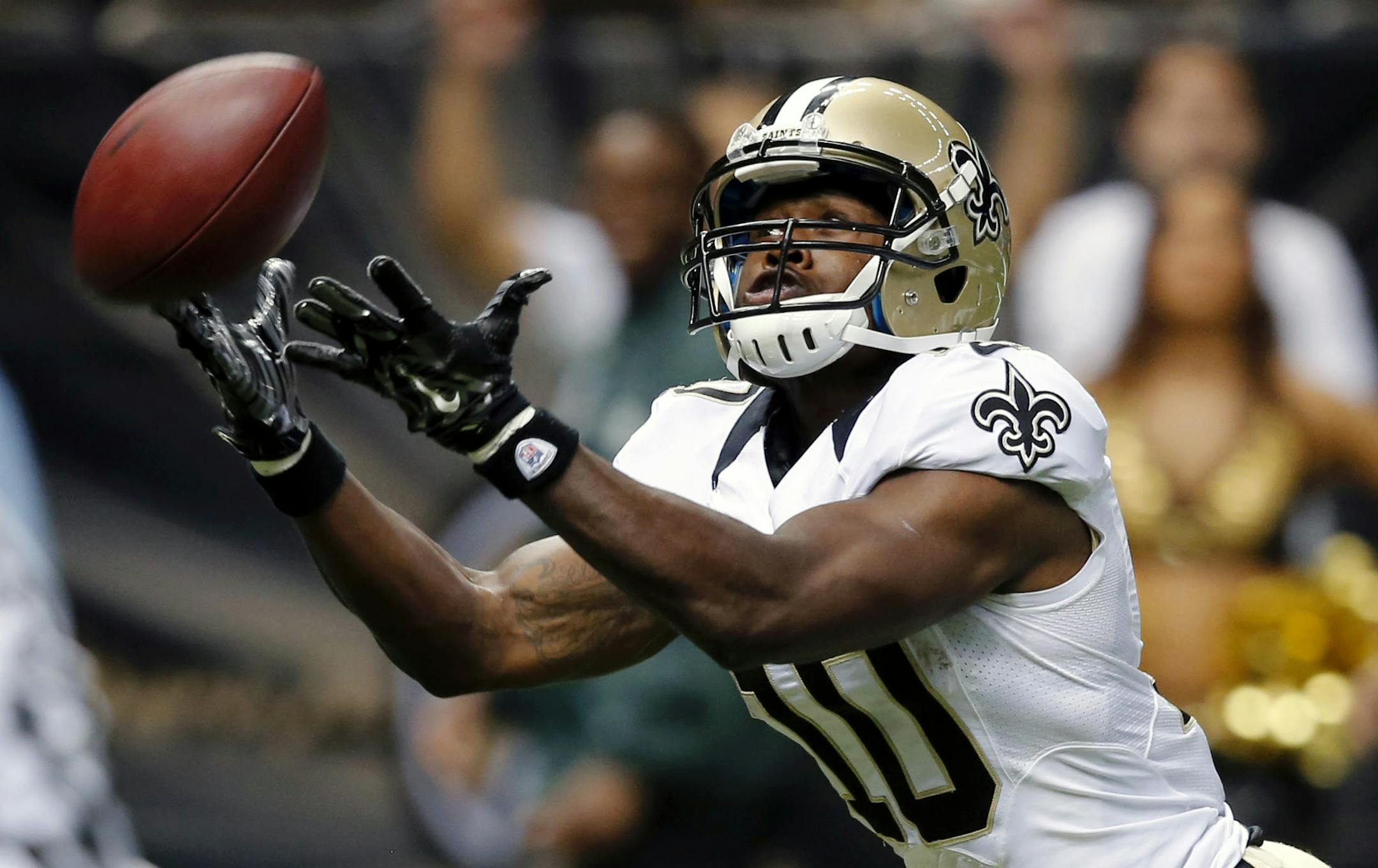 New Orleans Saints wide receiver Brandin Cooks (10) tries in vain to pull in a long pass in the second half of a NFL preseason football game against the Tennessee Titans in New Orleans, Friday, Aug. 15, 2014. (AP Photo/Bill Haber) ORG XMIT: LAGH129