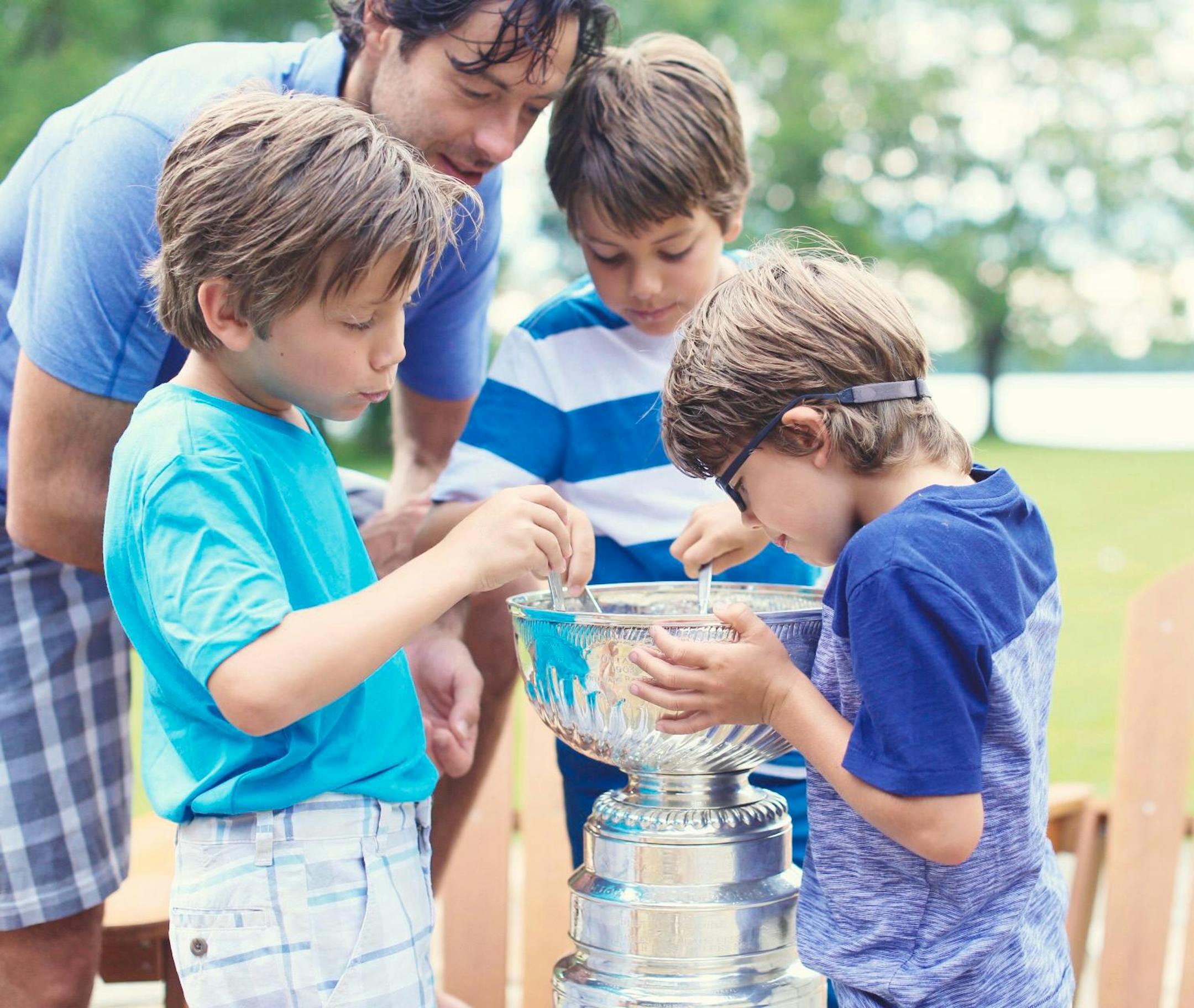 Matt Cullen and his kids eat Lucky Charms out of the Stanley Cup.