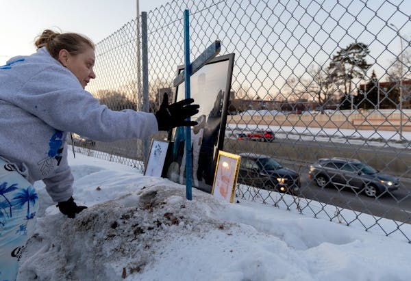 During a Jan. 30 vigil, Marsha Fugett placed a cross at the accident site in Bloomington where her children were struck. Donald E. Gayton Jr., 17, die