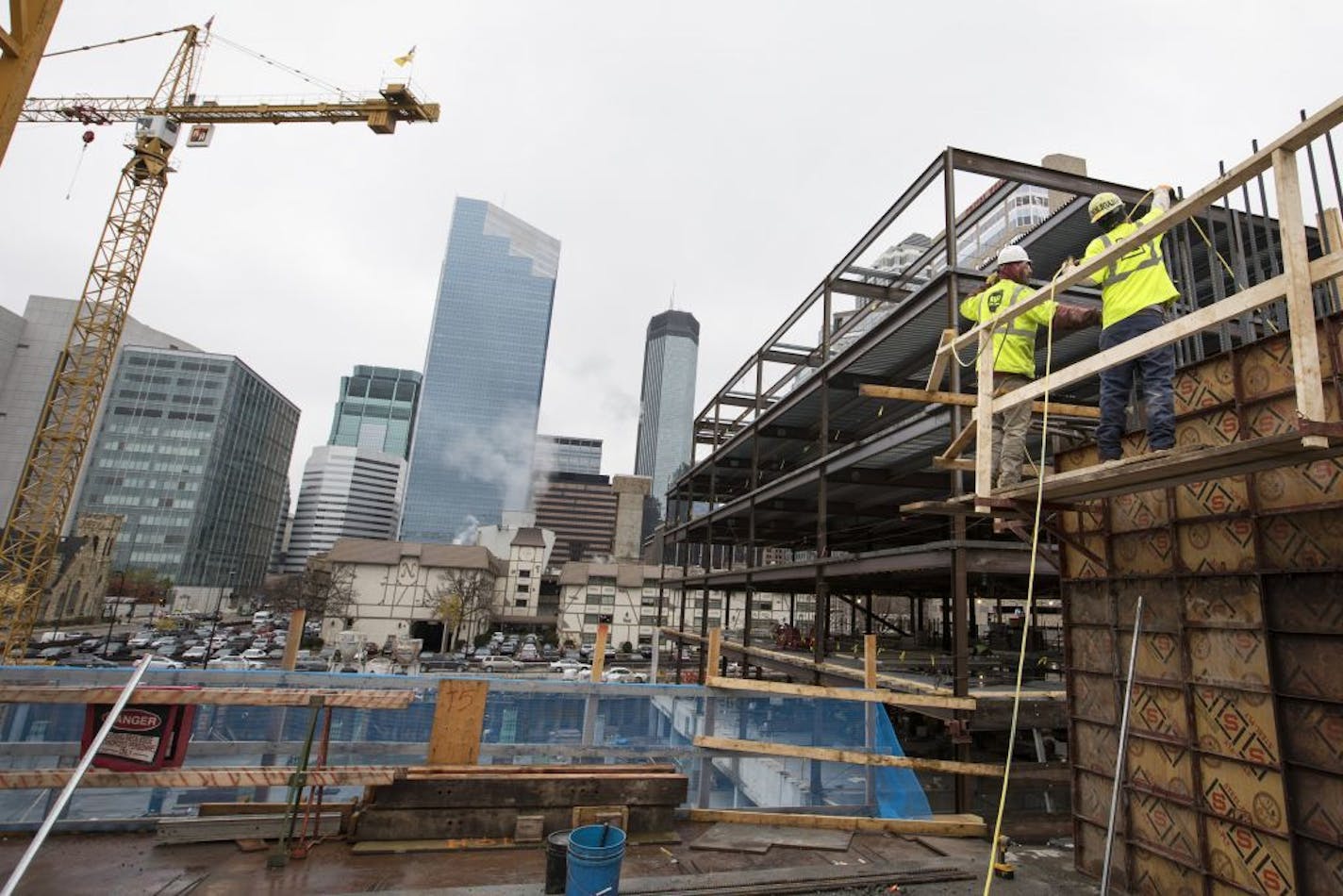 Construction workers work on the elevator shaft walls of a new 17-story residential tower located at Portland Ave. and 9th Street in downtown Minneapolis.