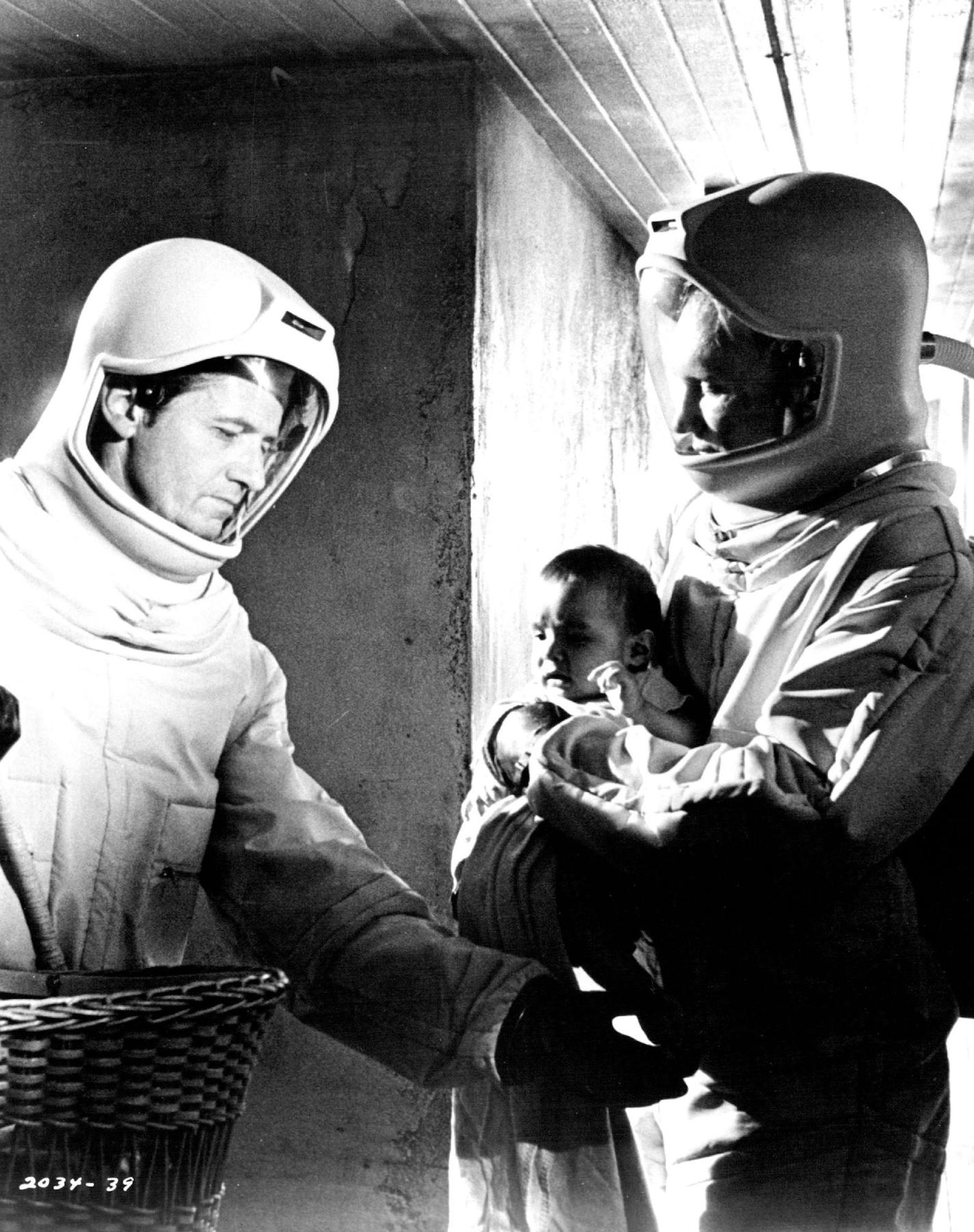 Arthur Hill (left) and James Olson, scientists in "The Andromeda Strain," discover that an infant is one of two survivors of a lethal organism that has descended from outer ace to a remote desert village.