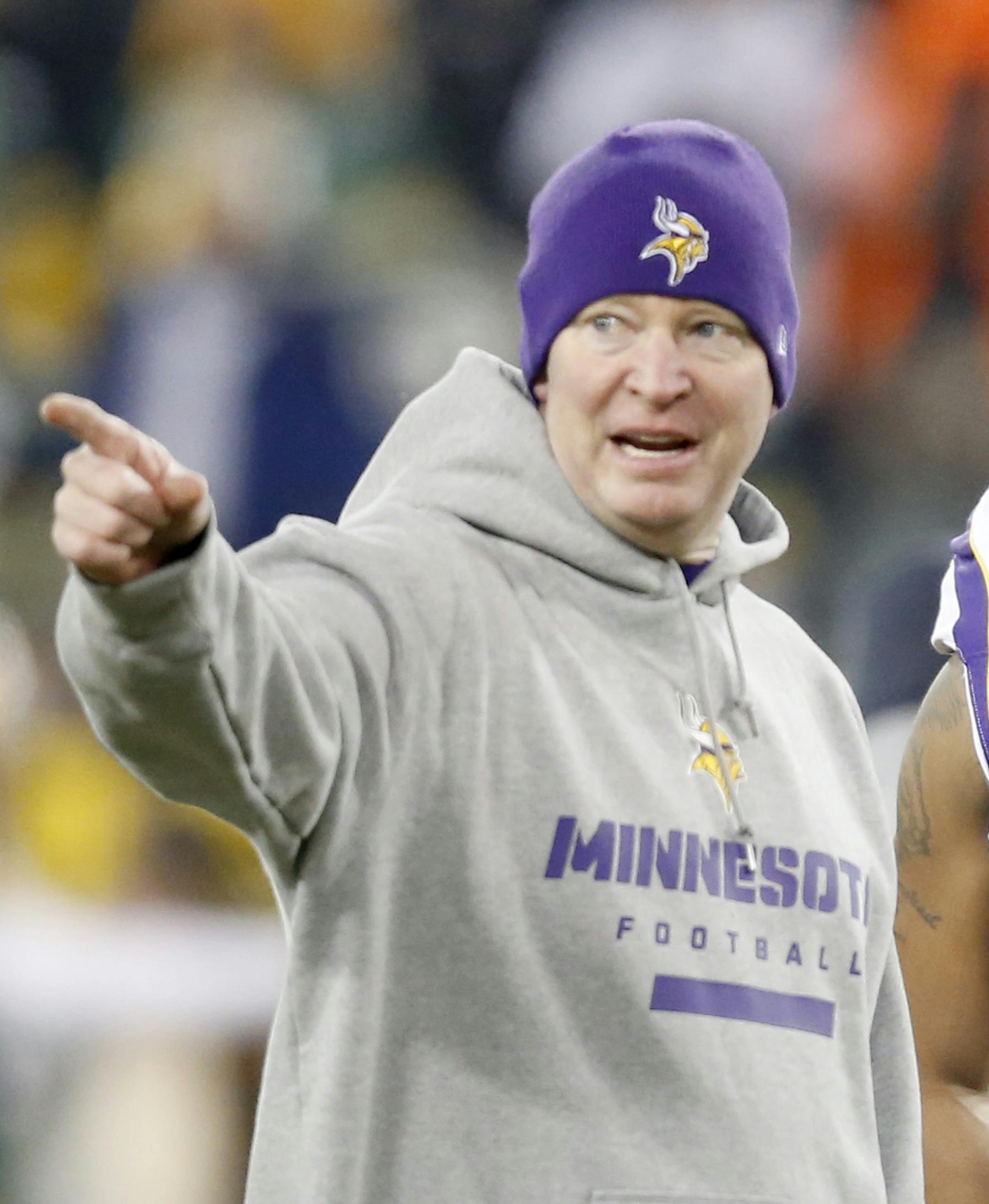 Vikings quarterback Joe Webb (14) and offensive coordinator Bill Musgrave spoke during pre game warm ups. ] CARLOS GONZALEZ cgonzalez@startribune.com - January 5, 2013 Green Bay, WI, Lambeau Field, NFL Playoffs, Minnesota Vikings vs. Green Bay Packers