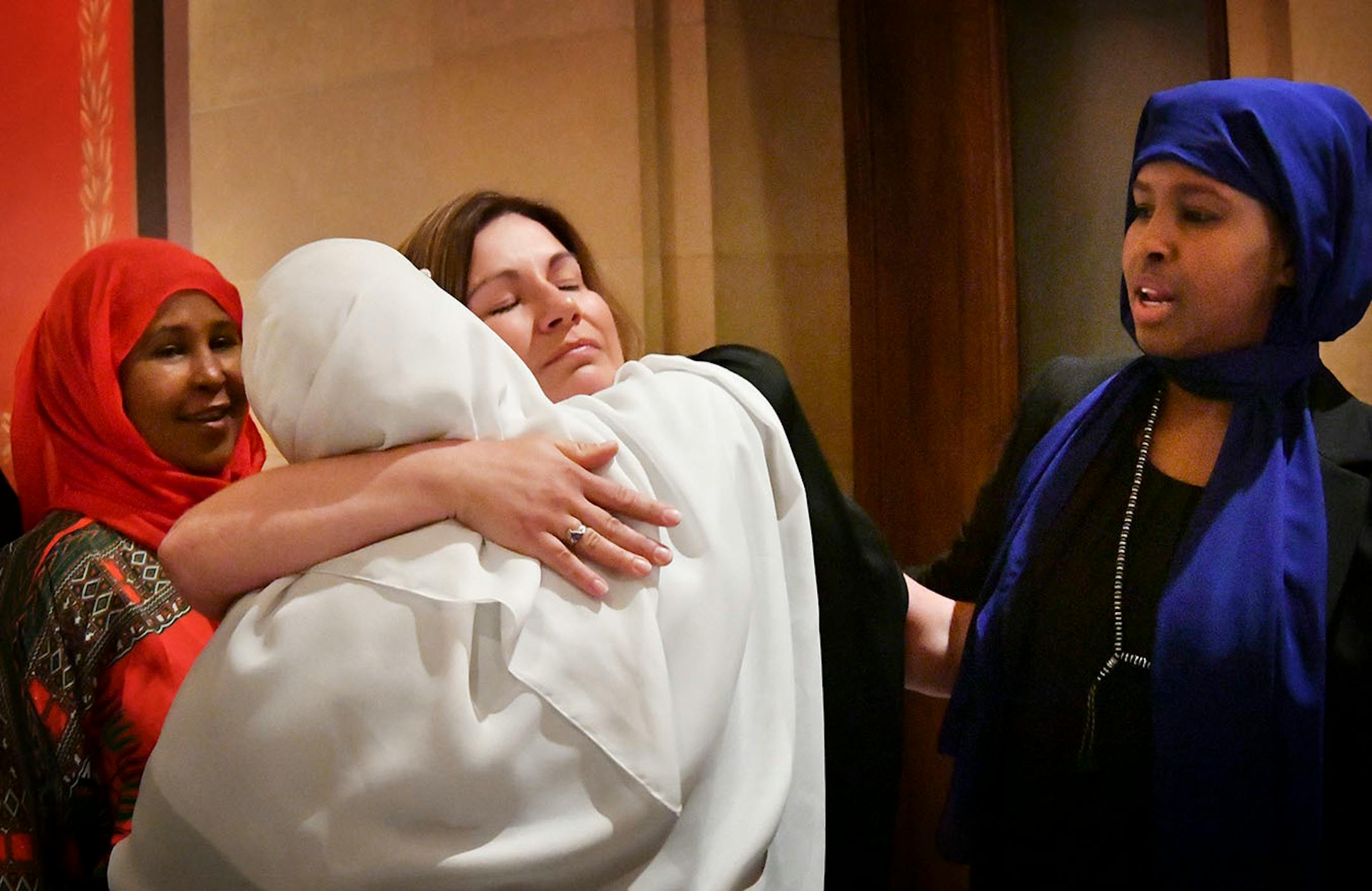Representative Mary Franson, R-Alexandria, hugged genital mutilation survivors who supported her bill. L to R Fadumo Abdinur , Waris Mohamud and Farhio Khalif.