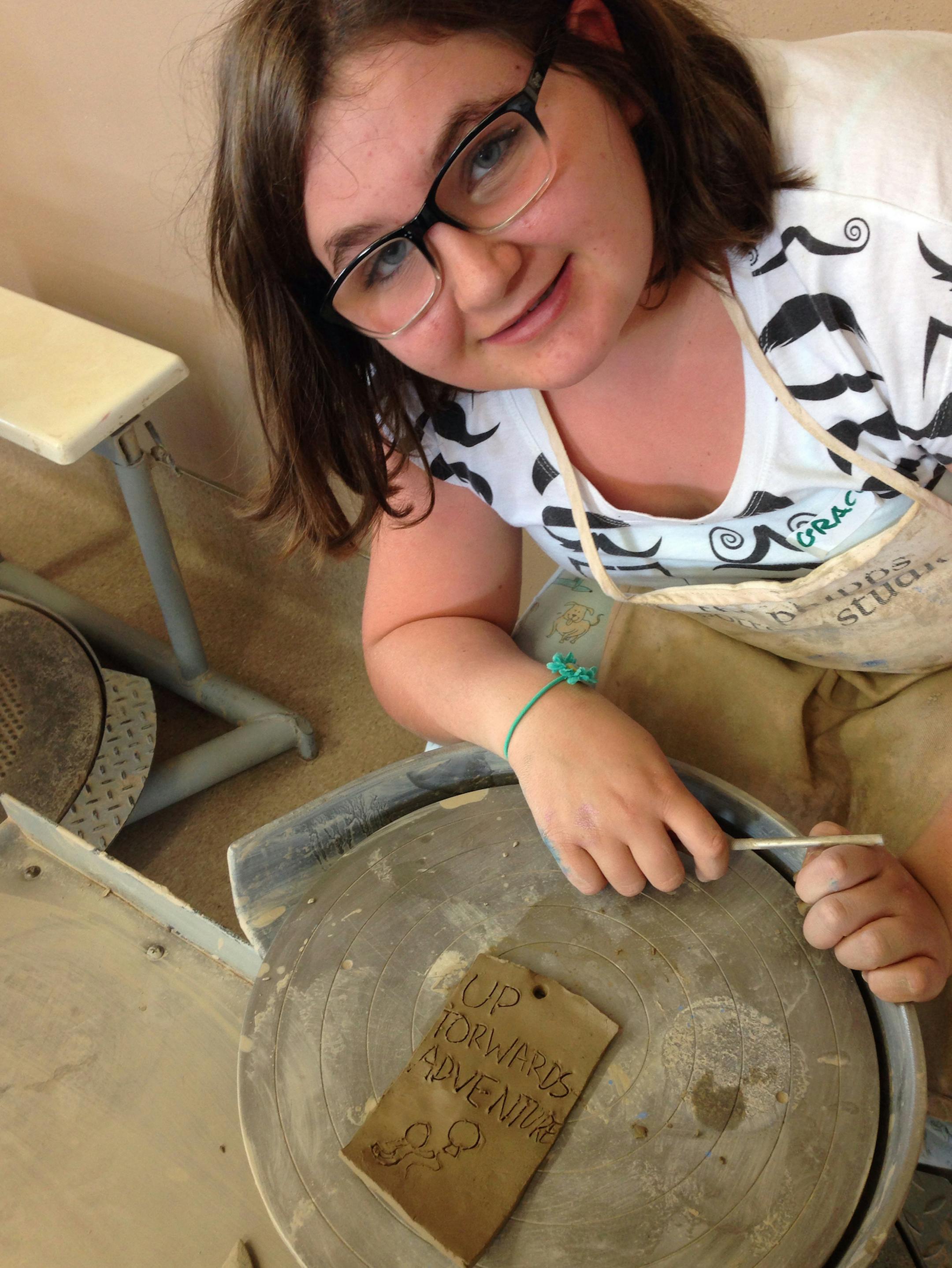 Grace Pesavanto (Hudson, WI), working in The Phipps ceramic studio during Summer Art Camp.