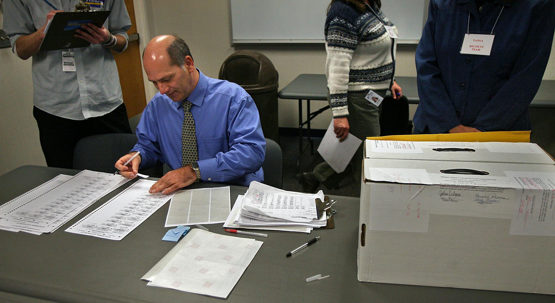 Minnesota election director Gary Poser handled the final ballot to be recounted in Minnesota, a vote cast in the city of Montrose, Precinct #0135, at the Wright County Government Center in Buffalo. The ballot was then placed with all others from the county in a locked room.