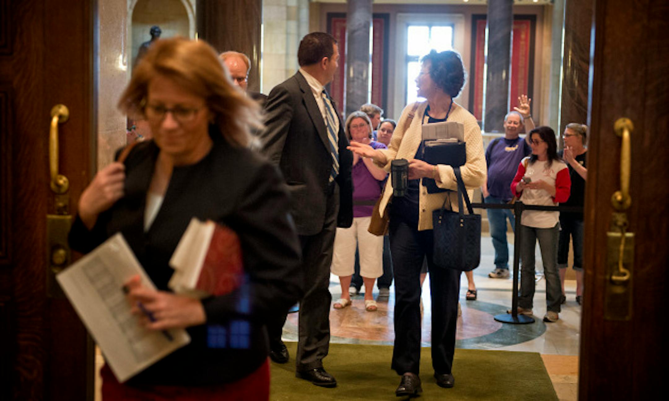 House Majority Leader Erin Murphy arrived for the noon session.   After adjourning at 7:00 a.m., legislators were back at work 5 hours later at noon and were greeted by around a dozen advocates from both sides of the daycare unionization issue.  Sunday, May 19, 2013  ]   GLEN STUBBE * gstubbe@startribune.com