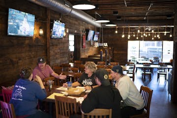 Daniel Hull, second from left, met with his managers Oct. 7 at the Nutty Squirrel Sports Saloon in River Falls, Wis.