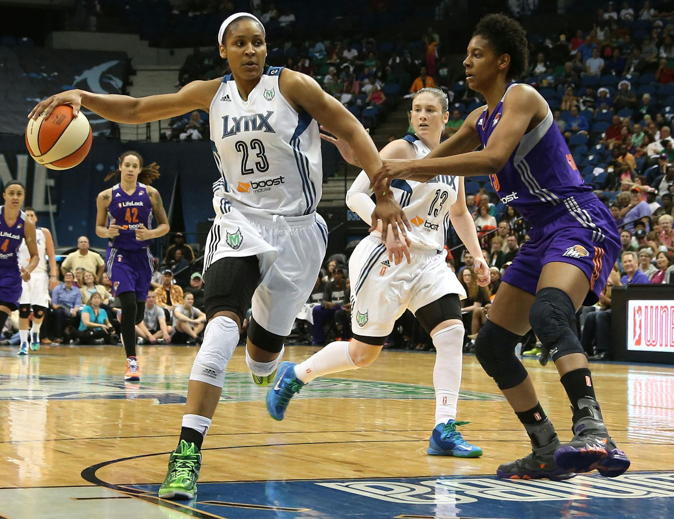 Maya Moore made a behind the back pass to guard Lindsay Whalen for a layup.
