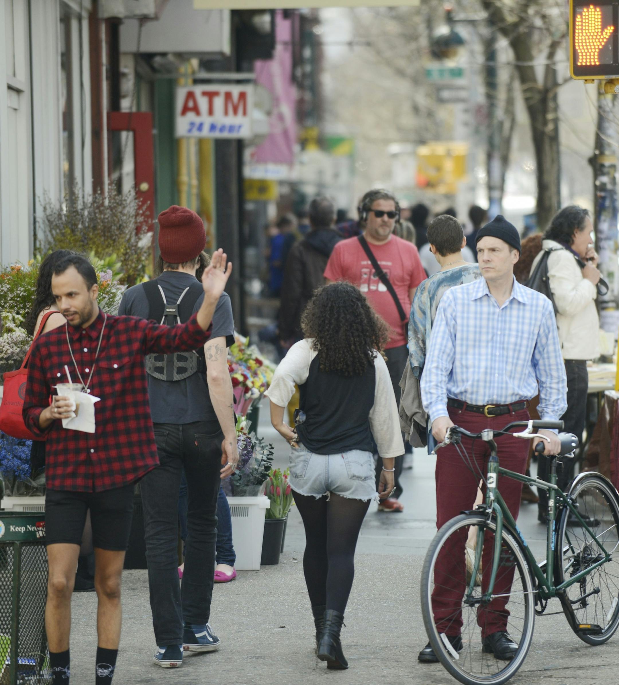 Henry Alford, a writer and an avowed Manhattanite, pauses at a busy corner with a bicycle he rented in the Williamsburg neighborhood of New York's Brooklyn borough, April 8, 2013. Alford embedded himself in artisan-loving, work-boot-wearing Brooklyn, the center of a culture quake. (Casey Kelbaugh/The New York Times) ORG XMIT: XNYT41