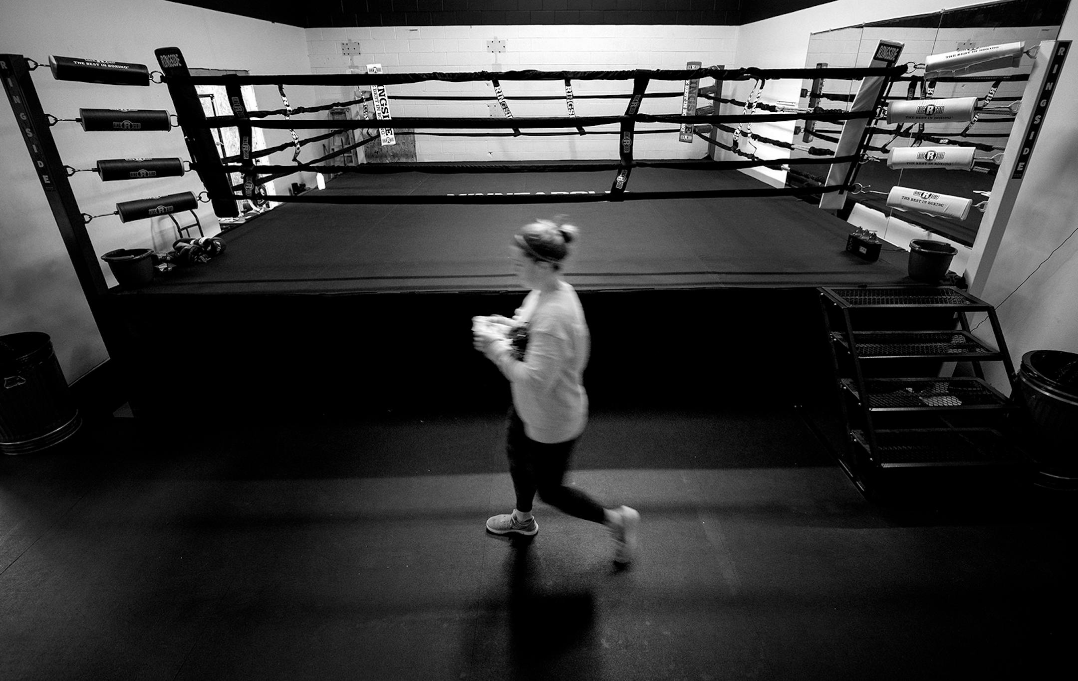 Heidi Amouta prepared to teach a virtual gym group boxing and strength conditioning via a computer at The Minneapolis Boxing Club. Amouta and her husband Joe own the Minneapolis Boxing Club.