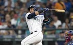 Seattle Mariners' Nelson Cruz takes as swing during an at-bat in a baseball game against the Los Angeles Dodgers, Saturday, Aug. 18, 2018, in Seattle.