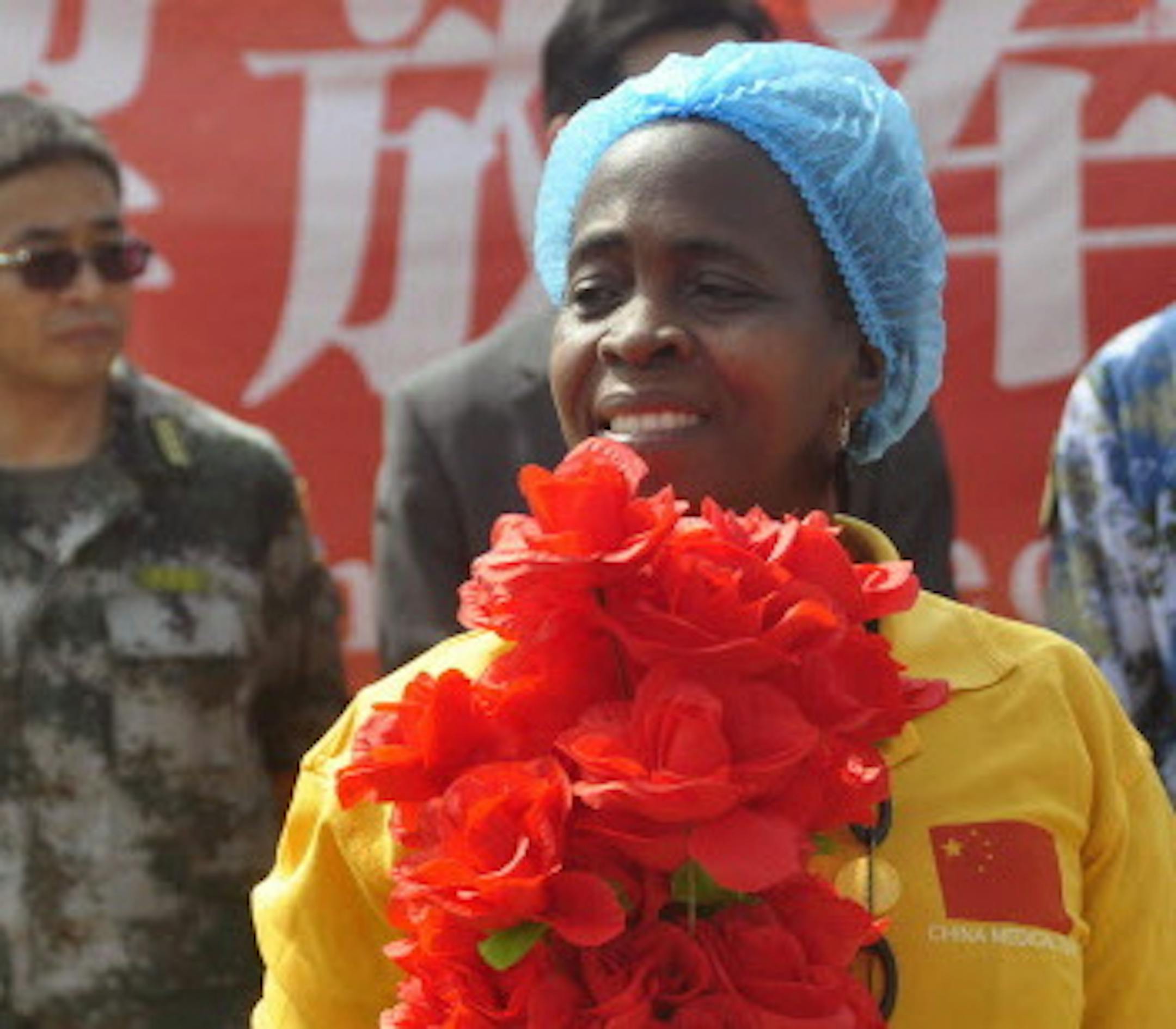 Ebola patient Beatrice Yardolo, celebrates with Ebola health workers as she leaves the Chinese Ebola treatment center were she was treated for Ebola virus infection on the outskirts of Monrovia, Liberia, Thursday, March 5, 2015. Liberia released its last Ebola patient, a 58-year old English teacher, from a treatment center in the capital on Thursday, beginning its countdown to being declared Ebola free. 'I am one of the happiest human beings today on earth because it was not easy going through t