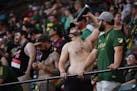 Fans try and stay cool amid sweltering, historically high temperatures in Portland before kickoff. The Portland Timbers play Minnesota United FC on Sa