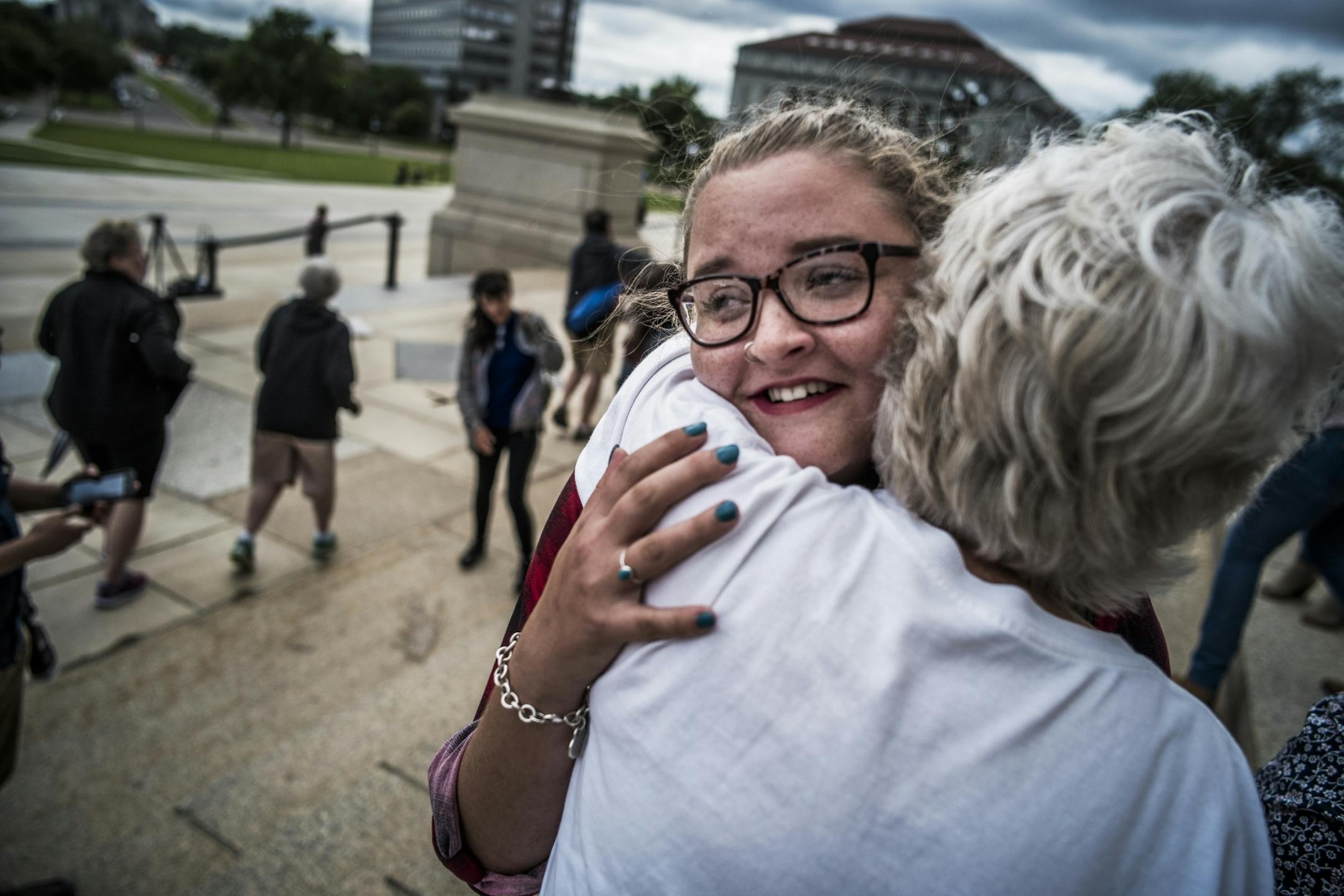 Erin Nanasi, a sexual assault survivor from the Children's Theatre comforted Sarah Kaleigh Seifert,21, who spoke of her rape by an acquaintance.