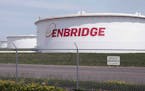 FILE - This June 29, 2018 photo shows tanks at the Enbridge Energy terminal in Superior, Wis. Enbridge Energy is delaying the startup of its planned L