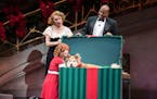 Ann Michels as Grace Ferrell, Lance Roberts as Oliver Warbucks, and Carly Gendell as Annie in "Annie" at the Ordway.