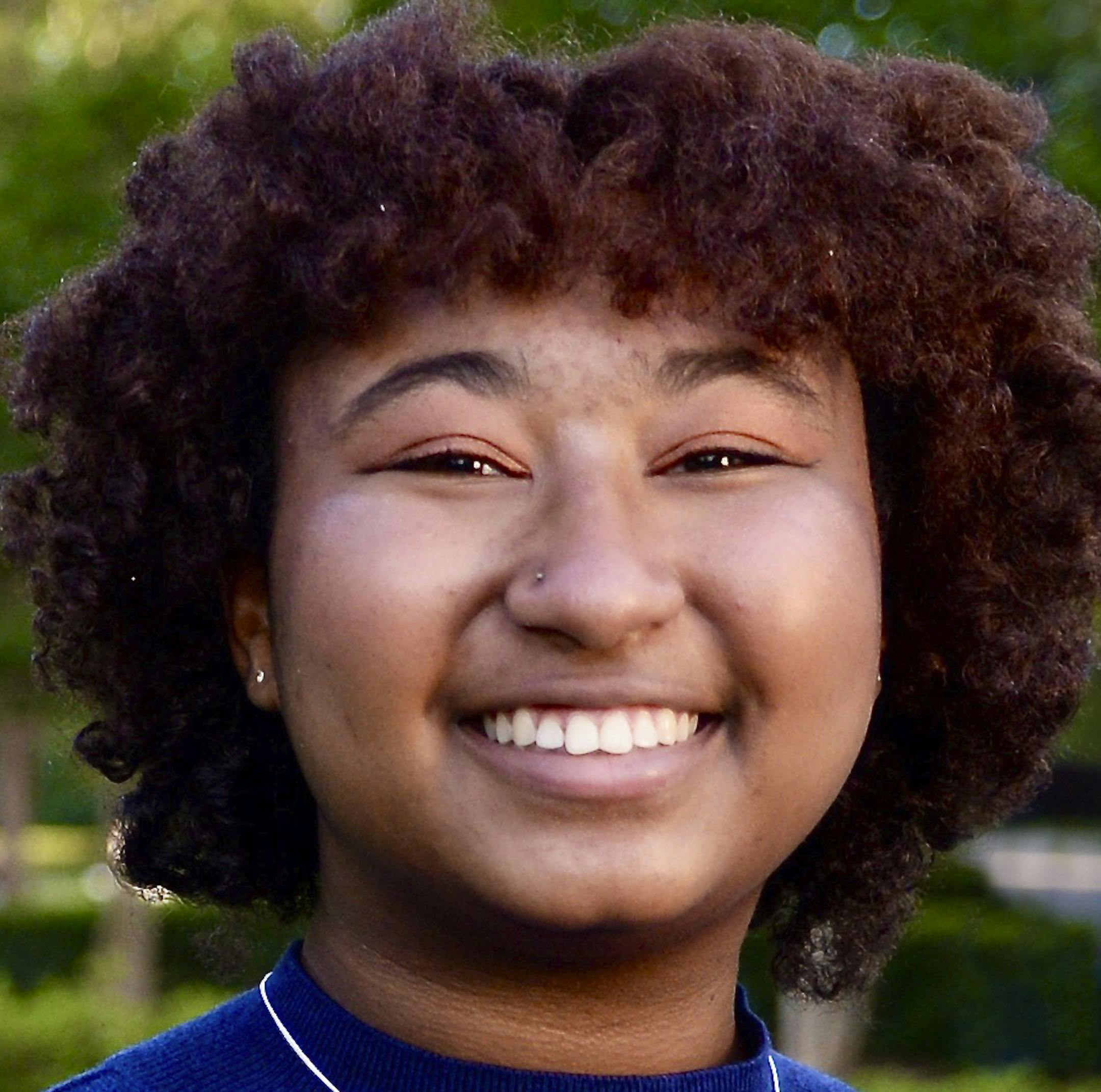 In a photo provided by Belhaven University, aspiring author Imani Skipwith poses for a photo on the Belhaven campus in Jackson, Miss., April 20, 2020. Skipwith is the first recipient of the Angie Thomas Scholarship, which Belhaven created to honor the author of bestselling young-adult novels. Thomas is a 2011 Belhaven graduate who wrote “The Hate U Give” and “On the Come Up,” and she is working on her third novel. Skipwith is graduating from the Mississippi School of