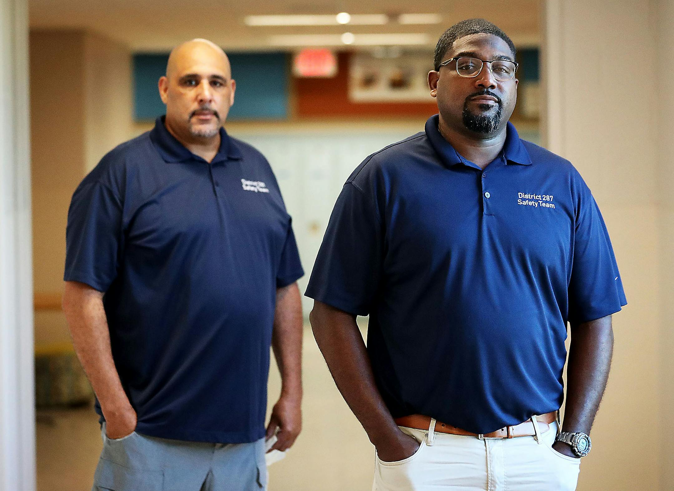 Intermediate District 287 student and safety coaches Theon Jarrett, right, and Don West have replaced police officers in district schools and among the tools they employ are hugs for students in need of encouragement. West and Jarrett, who is also the student and staff safety manager, were photographed at Ann Bremer Education Center Thursday in Brooklyn Park.] DAVID JOLES • david.joles@startribune.com As school districts cut ties with police and look for ways to replace the cops they once deploy